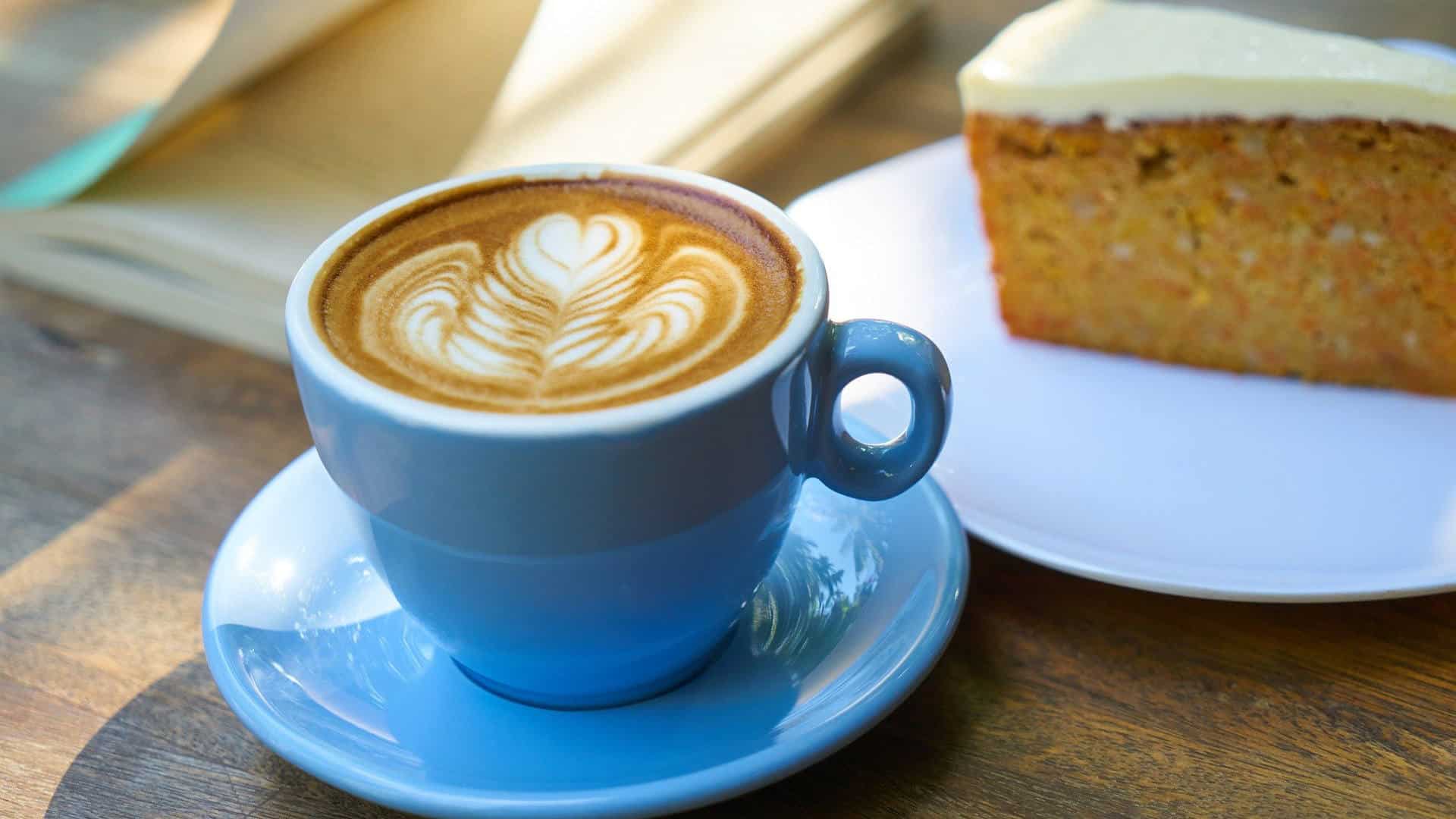 Cup of coffee with a slice of cake