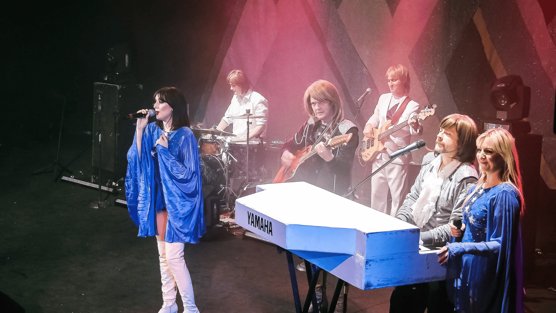 ABBA tribute band on stage singing