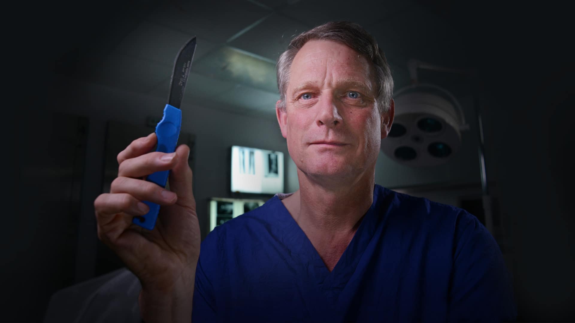 Dr Richard Shepherd holding up a scalpel - promotional image