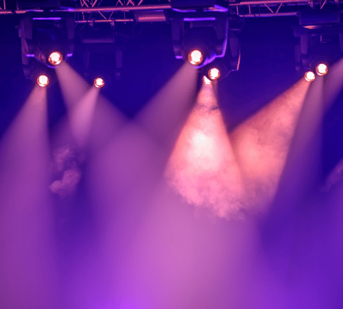 Theatre spotlights shining through smoke