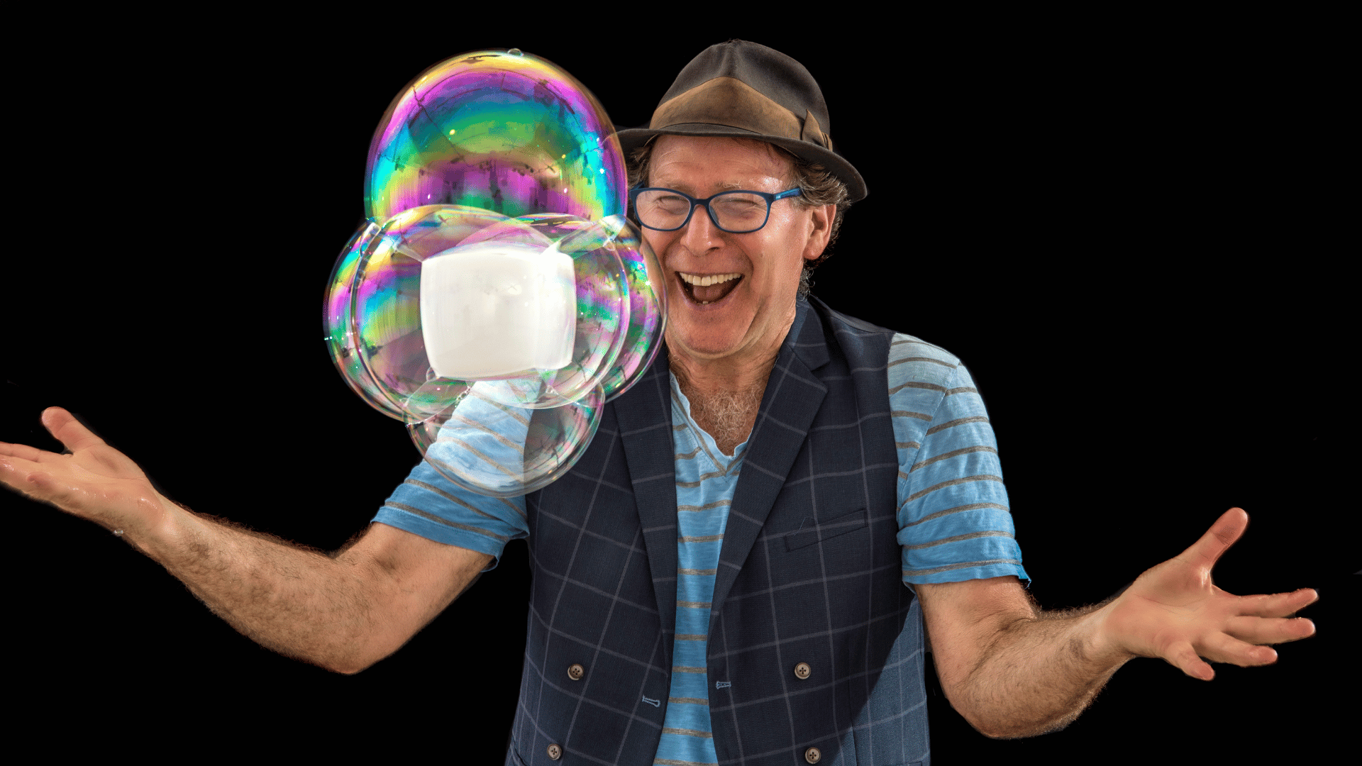 The Amazing Bubble Man has created a floating cube inside a collection of bubbles!