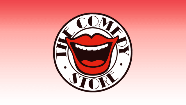 Comedy store logo: a white circle with the words 'The Comedy Store' around the edge and a laughing mouth with red lips in the centre.