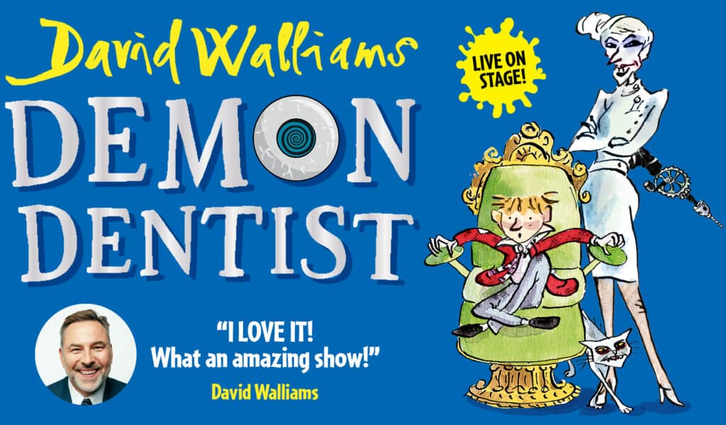 Demon Dentist artwork. Background: Blue. Foreground (left to right): (Left) Title text reads ‘David Walliams Demon Dentist Live on Stage’. (Right) An illustration of an evil looking dentist holding a mechanical drill stood behind a young boy squirming in a green chair. A white cat walks over the dentist’s leg. Under the title there is a headshot photo of David Walliams smiling with text next to it reading: