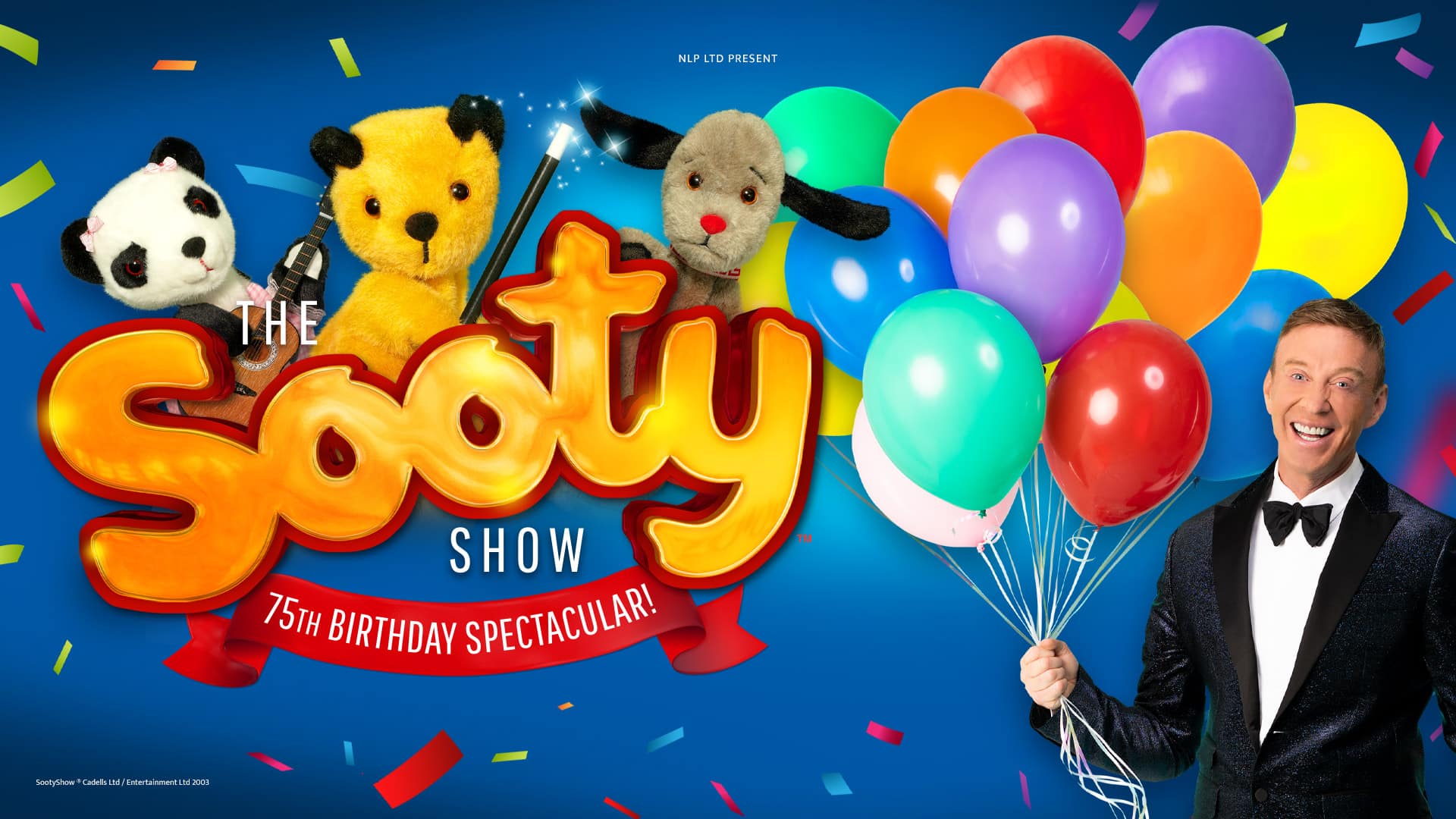 The Sooty Show artwork - On the left: Soo (panda bear glove puppet) holding a puppet-sized guitar, Sooty (yellow bear glove puppet) holding a magic wand, and Sweep (grey dog glove puppet) all peeking out from the Sooty logo - bubbly bold yellow letters with red outline spelling 'Sooty'. Text reads: The Sooty Show ; 75th anniversary spectacular.On the right: A smiling man in a dark blue, glittery tuxedo with a white shirt and black bowtie, holding a bunch of colourful balloons on string. The background is a deep blue and colourful confetti is scattered about the image.