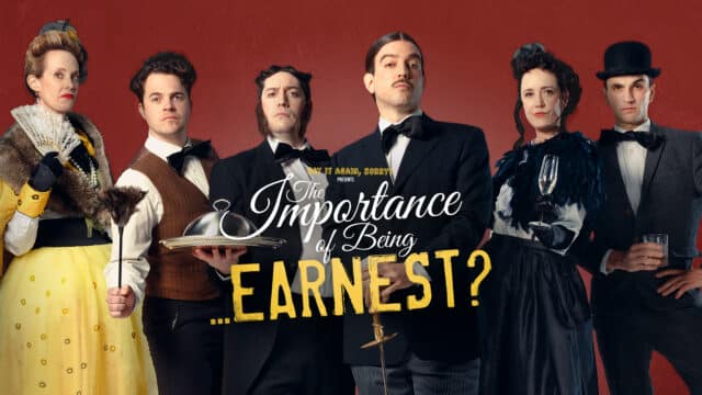 The Importance of Being... Earnest? Promotional Artwork: maroon background; an assortment of characters stand in a motley group; a man in a bowler hat, holding a glass of whiskey; a man dressed in tails holding a rapier; a man in a brown waistcoat holding a duster; a woman in a yellow dress and fur stole, holding a lace fan; a woman in a black skirt ad feathered shall, holding a glass of champaign, a man dressed as a butler holding a silver tray and cloche. Overlaid on the image is the title treatment in white and yellow letters that reads: Say It Again, Sorry? Presents: The Importance of Being… Ernest?