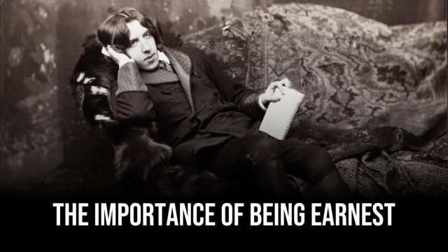 A black and white photograph of Oscar Wilde lounging with notepaper in hand. Overlaid text reads 'The Importance of Being Earnest'.