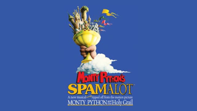 The Maynard School Spamalot artwork. Blue background. (Top) An illustration of a hand reaching out from a cloud, holding a golden cup with a castle, a group of medieval soldiers, King Arthur and members of his round table. (Bottom) text reads: 'Monty Python’s Spamalot TM. A new musical lovingly ripped off from the motion picture Monty Python and the Holy Grail.'