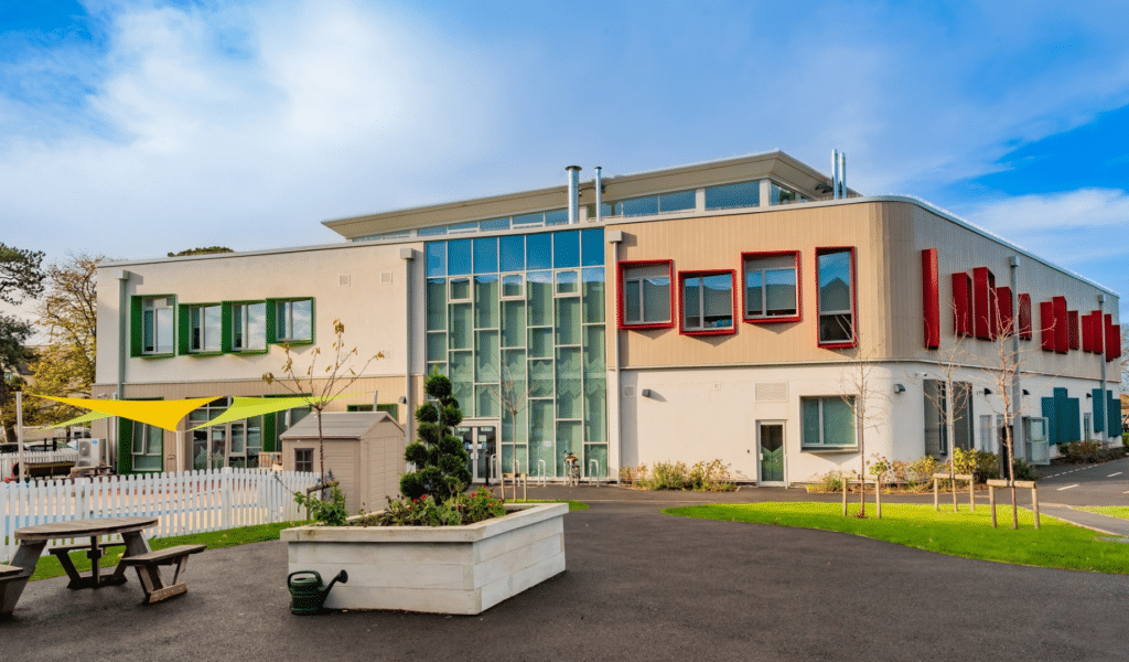 Photo of the exterior of the Deaf Academy on a bright day.