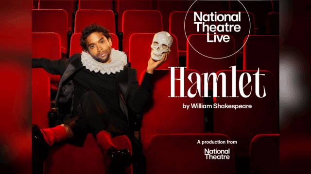 Hamlet promotional artwork: a photograph of Hiran Abeysekera wearing a suit and a ruff. He is sitting on a red theatre seating with his legs crossed and his feet resting on the seat in front. Text reads: 'National Theatre Live. Hamlet by William Shakespeare. A production by the National Theatre'.