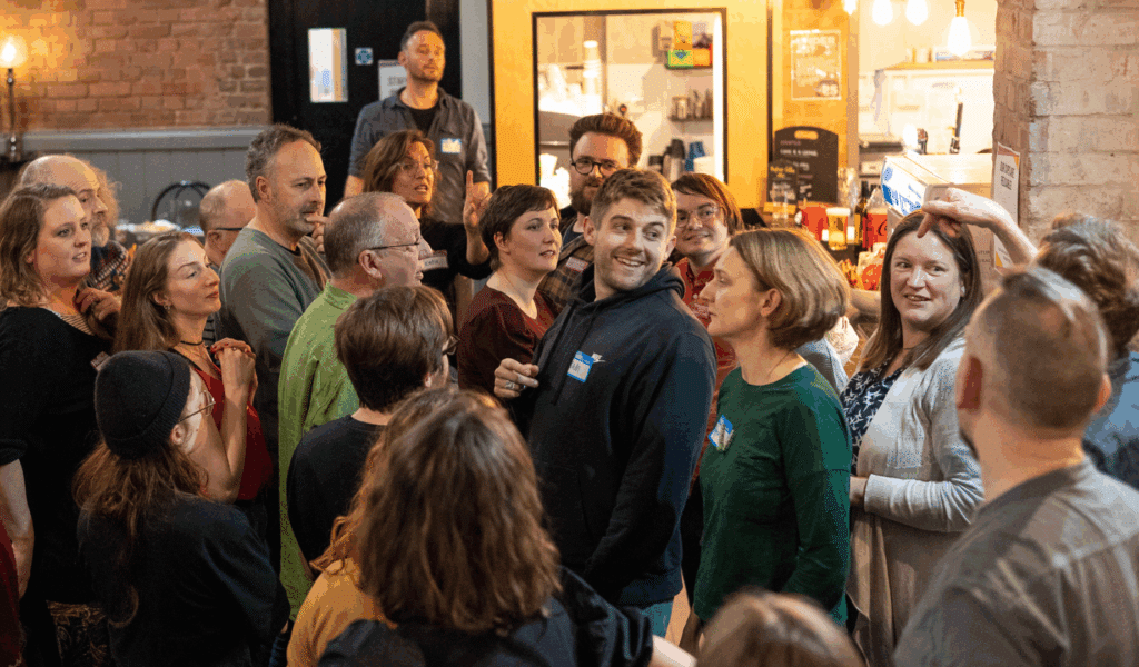 Photo of a group of people gathered in the Barnfield Theatre Bar.