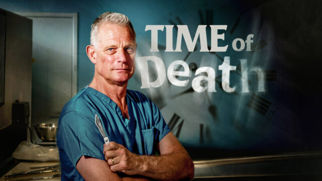 Dr Richrad Shepherd stands arms crossed, wearing scrubs and a stethoscope aroudn his neck. Text reads: TIME OF DEATH