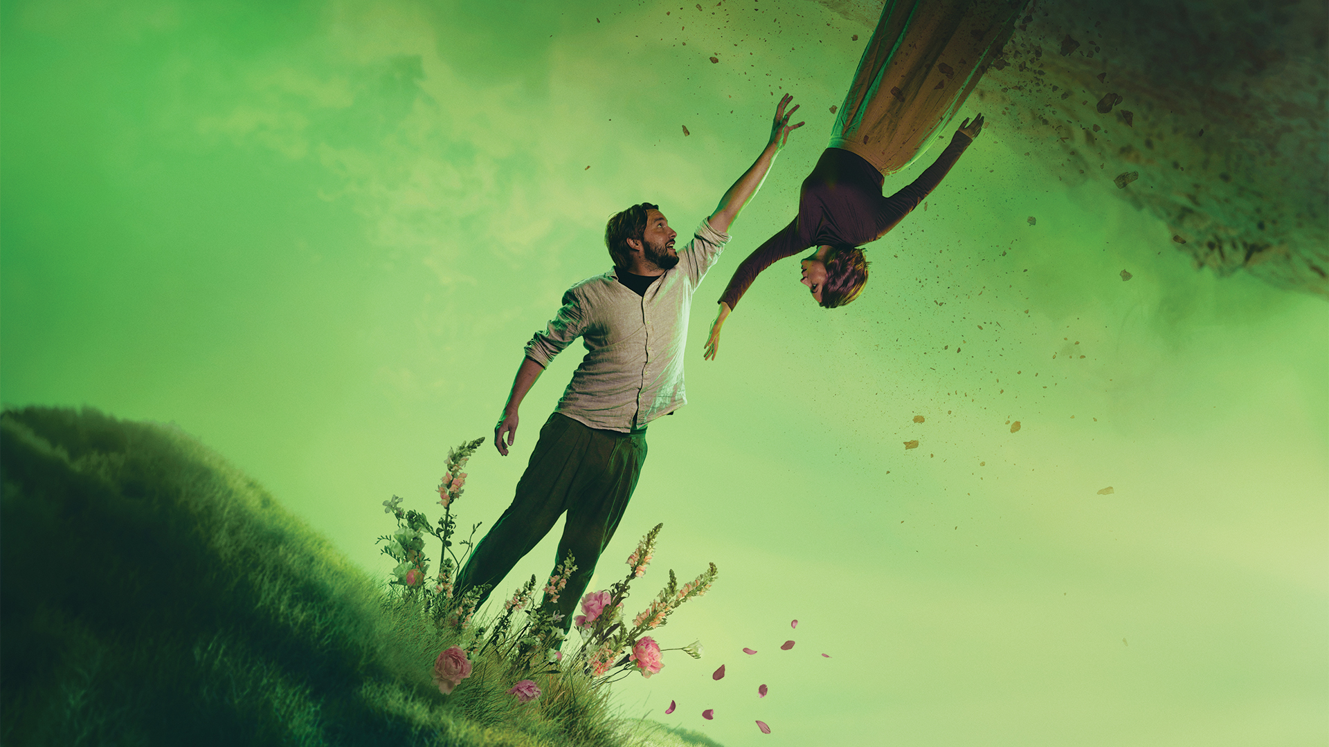 English Touring Opera: Gluck: Orpheus and Eurydice show artwork. Image shows Orpheus and Eurydice in an ethereal green world, both standing on mounds of grass reaching their hands out toward each other.